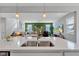 Bright living room viewed from the kitchen, featuring a green accent wall and comfortable seating at 6622 Cardiff Cir, McCordsville, IN 46055