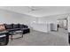 Inviting living room with spacious layout, neutral carpet, and ample seating, perfect for relaxation or entertaining at 6622 Cardiff Cir, McCordsville, IN 46055