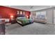 Bright main bedroom with an accent wall, soft carpet and a comfortable seating area at 6622 Cardiff Cir, McCordsville, IN 46055