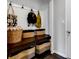 Functional mudroom with hooks, bench, and woven storage baskets for organization near the home's entrance at 6622 Cardiff Cir, McCordsville, IN 46055