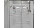 Close up of shower featuring glass doors, modern showerhead and plenty of storage space at 6622 Cardiff Cir, McCordsville, IN 46055