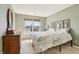 A charming bedroom is brightened by a large window with floral bedding at 7048 Tassel Meadow Dr, Indianapolis, IN 46217