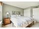 A well-lit bedroom features neutral walls and carpet, creating a serene retreat at 7048 Tassel Meadow Dr, Indianapolis, IN 46217