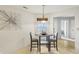 Cozy dining area with a round table, stylish chairs, and natural light from a window at 7048 Tassel Meadow Dr, Indianapolis, IN 46217