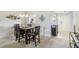 Formal dining room with wood table, seating for six, and stylish decor leading to front entrance at 7048 Tassel Meadow Dr, Indianapolis, IN 46217