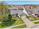 Aerial view of a single-Gathering home featuring well-manicured front yard, attached garage, and welcoming curb appeal at 7048 Tassel Meadow Dr, Indianapolis, IN 46217