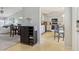 Inviting foyer with a shoe rack, showcasing the home's open floor plan and kitchen at 7048 Tassel Meadow Dr, Indianapolis, IN 46217