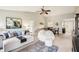 Spacious living room with modern decor, featuring a comfortable seating area and ample natural light at 7048 Tassel Meadow Dr, Indianapolis, IN 46217