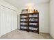 A spacious office features a closet and custom wall shelving at 7048 Tassel Meadow Dr, Indianapolis, IN 46217