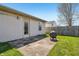 Back patio area with a grill and a wooden privacy fence at 7048 Tassel Meadow Dr, Indianapolis, IN 46217