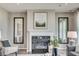 Cozy living room featuring a fireplace, stylish decor, and a comfortable seating area at 7331 Deerberg Dr, Indianapolis, IN 46259
