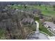 Aerial view of a property with lush greenery and a sprawling lawn, situated near a golf course at 7424 Campfire Run, Indianapolis, IN 46236