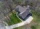 Aerial view of a luxurious home with a well-manicured lawn and a spacious driveway at 7424 Campfire Run, Indianapolis, IN 46236