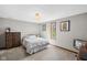 Bedroom with neutral walls, vintage TV, and light fixture at 7424 Campfire Run, Indianapolis, IN 46236