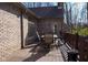Outdoor deck with dining furniture for entertaining and enjoying the wooded views at 7424 Campfire Run, Indianapolis, IN 46236