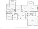 First floor plan showcasing layout of kitchen, living room, bedrooms, and garage at 7424 Campfire Run, Indianapolis, IN 46236