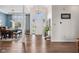 Bright foyer featuring hardwood flooring, chandelier and open floor plan into dining room at 7424 Campfire Run, Indianapolis, IN 46236