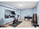 Basement gym with exercise equipment, a full-length mirror and plenty of workout space at 7424 Campfire Run, Indianapolis, IN 46236