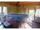 Enclosed patio with hot tub, creating a private relaxation space at 7424 Campfire Run, Indianapolis, IN 46236