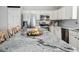 Modern kitchen features granite countertops, stainless steel appliances, and white cabinetry at 7424 Campfire Run, Indianapolis, IN 46236