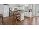 Bright kitchen with stainless steel appliances, granite counters, and wooden breakfast bar at 7424 Campfire Run, Indianapolis, IN 46236