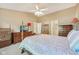 Spacious bedroom with vaulted ceiling, neutral carpet, and traditional furnishings at 7450 Deville Ct, Indianapolis, IN 46256