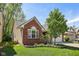 Beautiful home with a well-manicured lawn, landscaped garden, brick accents, and neutral siding at 7450 Deville Ct, Indianapolis, IN 46256