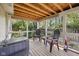 Relaxing screened porch with comfortable seating and an open view of the backyard at 7450 Deville Ct, Indianapolis, IN 46256