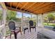 Relaxing screened porch with comfortable seating and an open view of the outdoor space at 7450 Deville Ct, Indianapolis, IN 46256