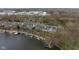 Aerial view of waterfront townhomes with docks and beautiful scenic water access at 7640 Bay Shore Dr, Indianapolis, IN 46240