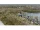 Aerial view of scenic waterfront townhomes with docks and beautiful water at 7640 Bay Shore Dr, Indianapolis, IN 46240