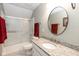 Bright bathroom featuring a shower, frosted sliding door and granite countertop at 7640 Bay Shore Dr, Indianapolis, IN 46240