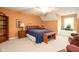 Cozy bedroom with a beautiful headboard, side table, and natural light from the windows at 7640 Bay Shore Dr, Indianapolis, IN 46240