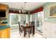 Cozy dining nook with exterior views and access to deck at 7640 Bay Shore Dr, Indianapolis, IN 46240