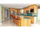 Bright kitchen with stainless appliances, breakfast bar, and open layout at 7640 Bay Shore Dr, Indianapolis, IN 46240