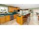 Open kitchen design with breakfast bar, stainless steel appliances, and an eat-in area at 7640 Bay Shore Dr, Indianapolis, IN 46240
