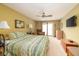 Main bedroom featuring natural light, private balcony, and neutral decor at 7640 Bay Shore Dr, Indianapolis, IN 46240