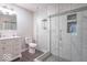 Beautifully renovated bathroom featuring a glass shower and modern vanity at 7748 S State Road 39, Clayton, IN 46118