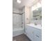 Renovated bathroom with tiled shower-tub, modern vanity, and luxury finishes at 7748 S State Road 39, Clayton, IN 46118