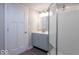 Bathroom featuring a stand up shower, sleek vanity, grey cabinets and luxury vinyl plank flooring at 7748 S State Road 39, Clayton, IN 46118
