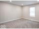 Modern bedroom with fresh paint, plush carpets, and a bright window at 7748 S State Road 39, Clayton, IN 46118
