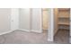 Bedroom featuring plush carpets and an attached, renovated bathroom at 7748 S State Road 39, Clayton, IN 46118