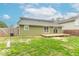 The back exterior reveals a freshly painted facade, a cozy deck, and a well-maintained yard at 7748 S State Road 39, Clayton, IN 46118