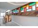 Hallway with grey carpet and colorful stained glass windows on the upper wall at 7748 S State Road 39, Clayton, IN 46118