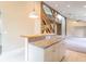 Bright, modern kitchen with a granite counter island with seating, pendant lighting, and open floorplan at 7748 S State Road 39, Clayton, IN 46118