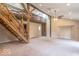 Spacious living room featuring a vaulted ceiling, wooden beams, and an indoor balcony accessible via wooden staircase at 7748 S State Road 39, Clayton, IN 46118