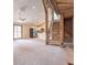 Open floorplan living room features a wooden beam staircase and vaulted ceiling with a ceiling fan at 7748 S State Road 39, Clayton, IN 46118