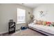 Bedroom with a daybed, throw pillows, a bookshelf and a window at 7782 Rose Ln, Ingalls, IN 46048