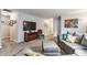 Cozy living room featuring comfortable seating, neutral tones, and seamless connectivity to other areas of the home at 7782 Rose Ln, Ingalls, IN 46048