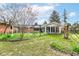 Scenic backyard featuring a brick patio and a charming house extension with many windows at 80 S Richland Ave, Carmel, IN 46032